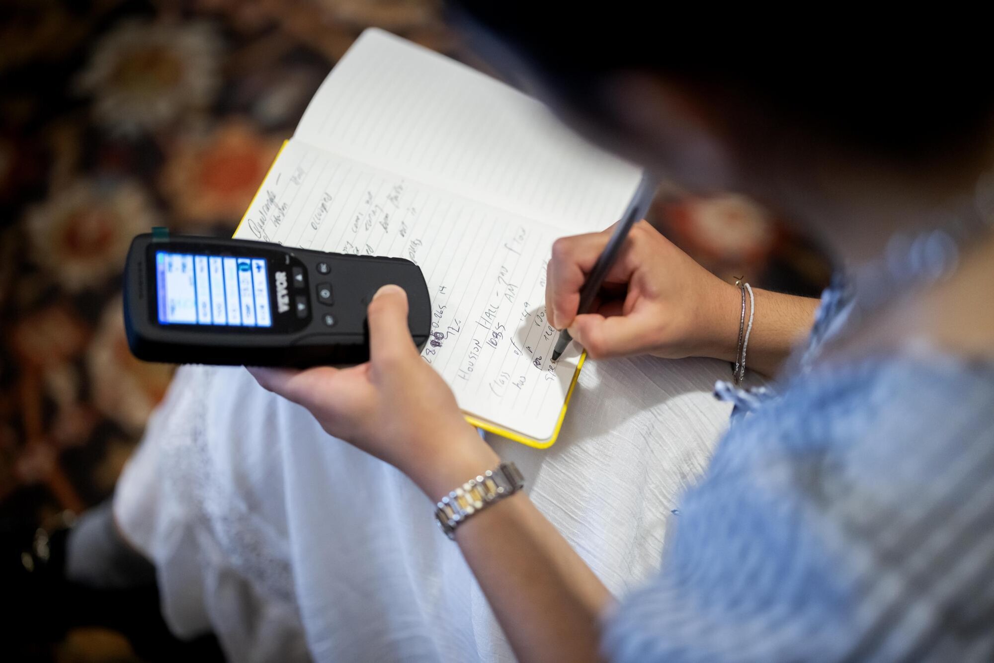 Veronica Baladi recording data in a notebook.