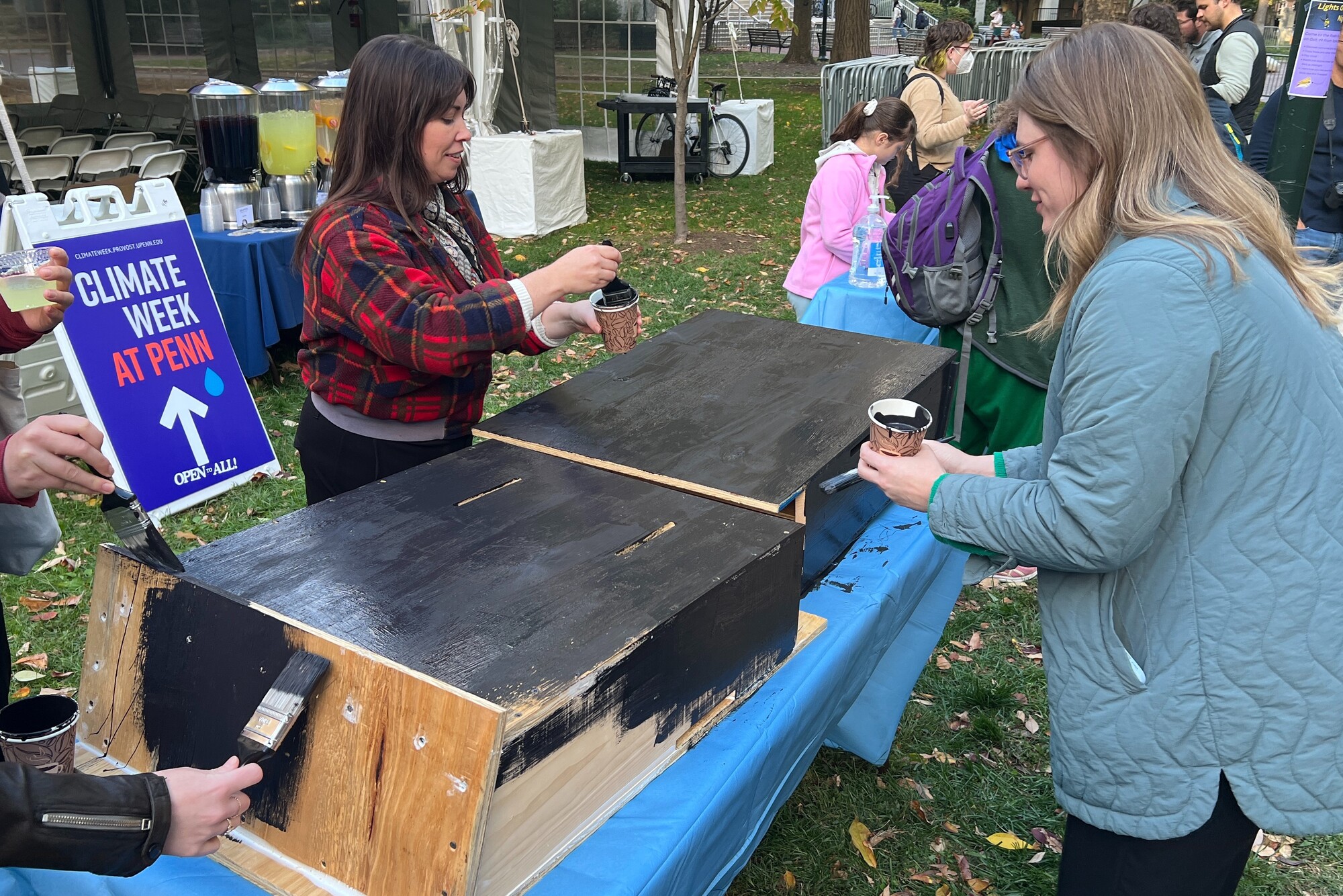 People painting bat boxes at Penn’s Climate Week.