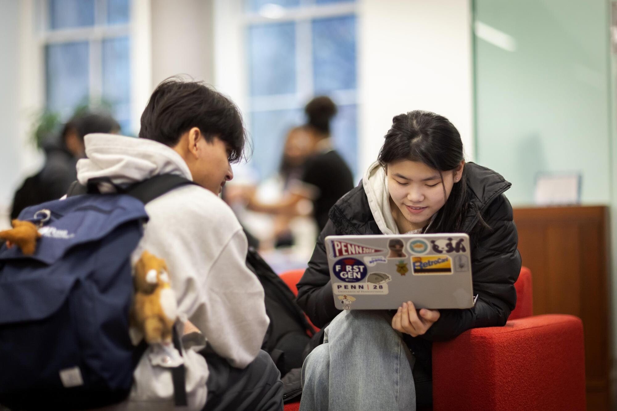 Undergraduates studying and socializing in the Penn First Plus office