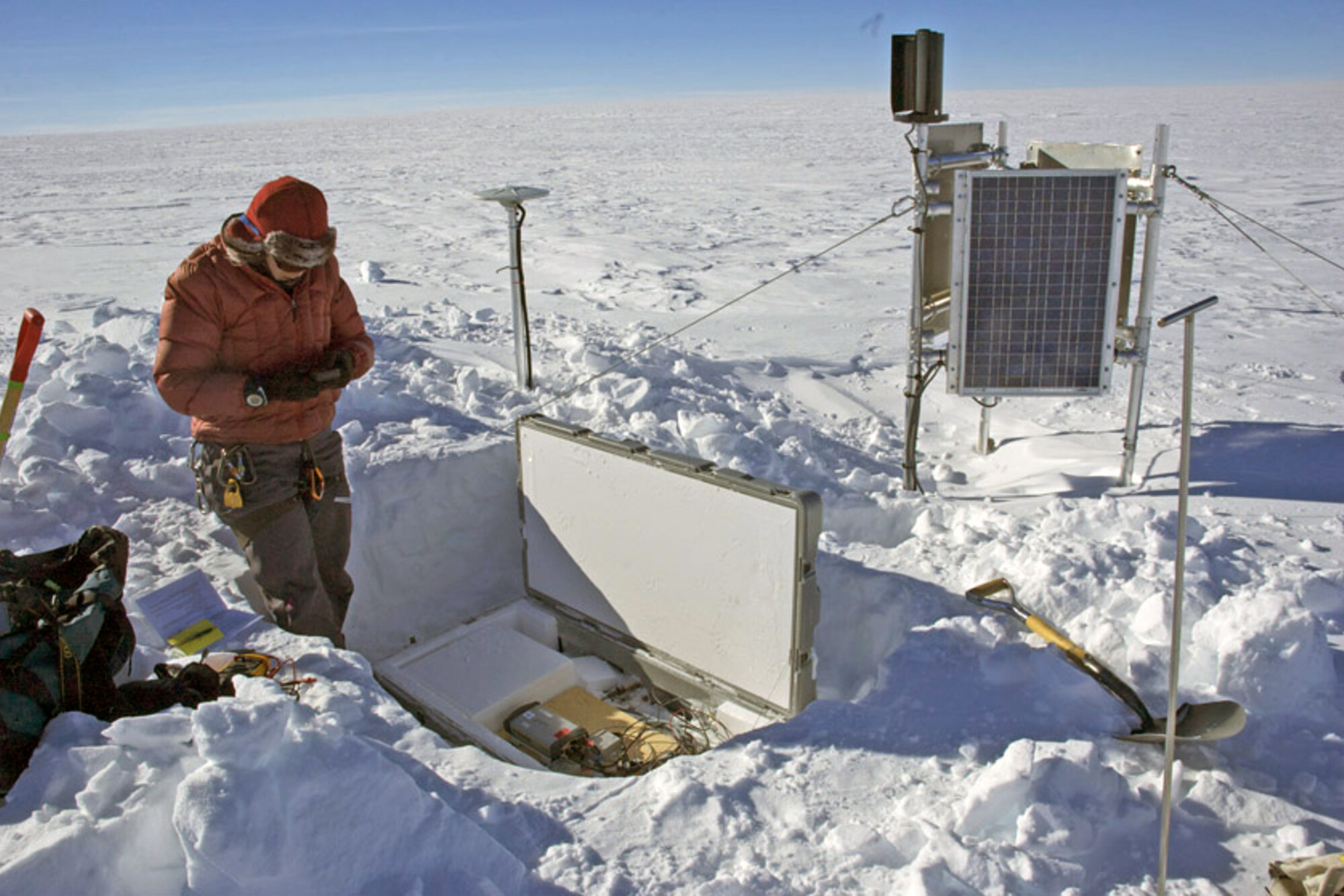 Leigh Stearns conducting research on melting glaciers in the snow.