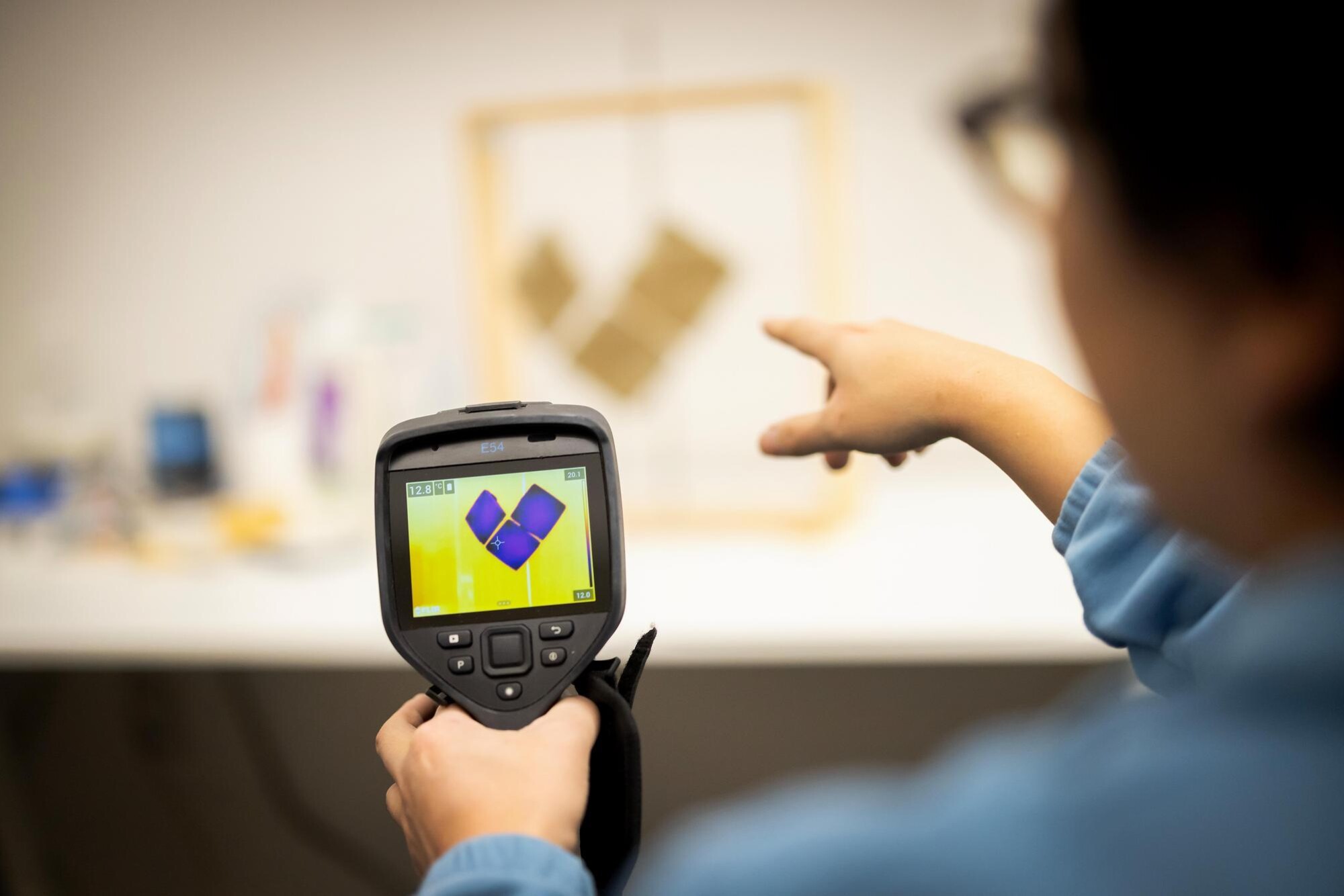 Ph.D. student Ji Yoon Bae testing at an evaporative cooling façade prototype with an infrared camera. 