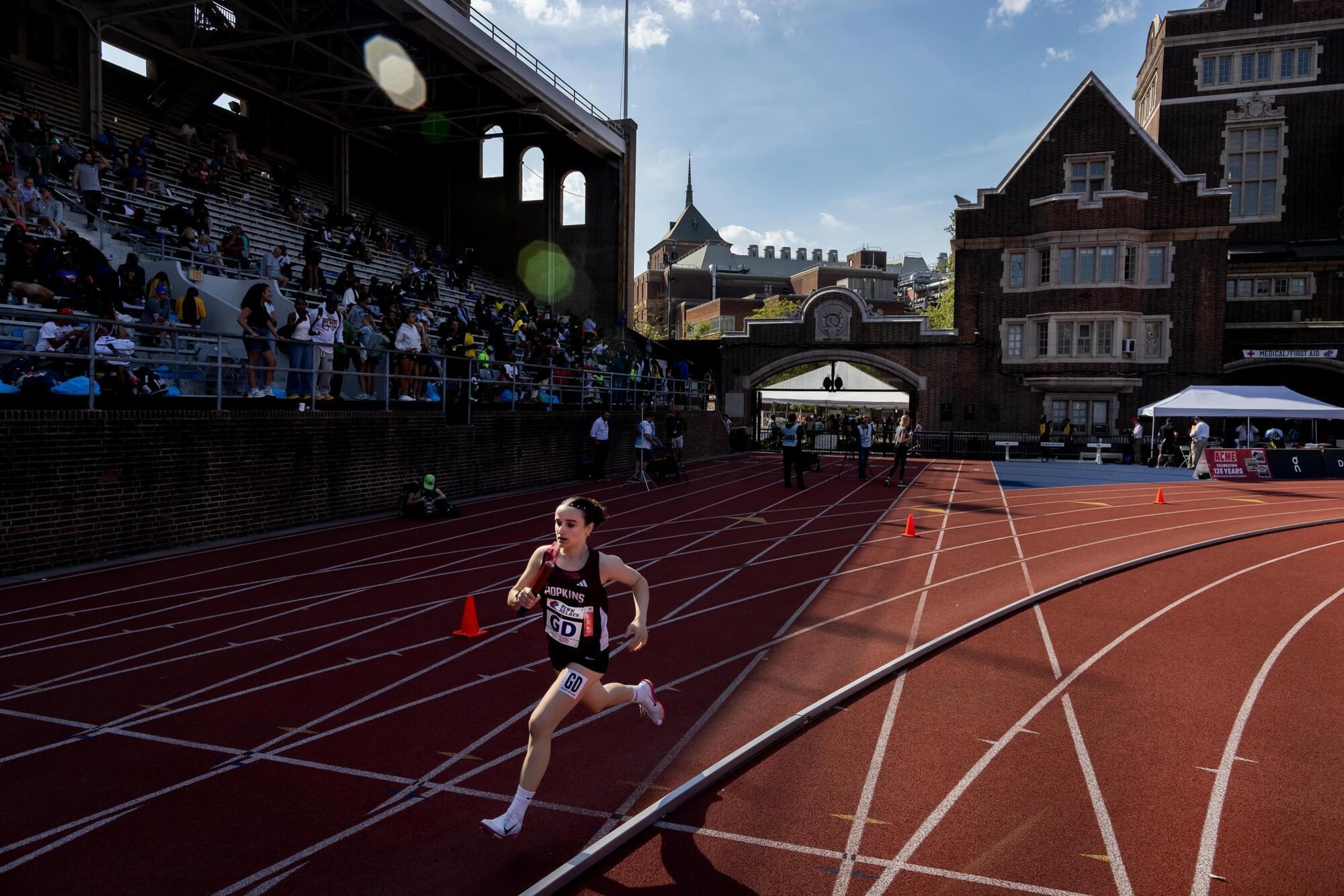 A Runner on the track at Franklin Field during Penn Relays.