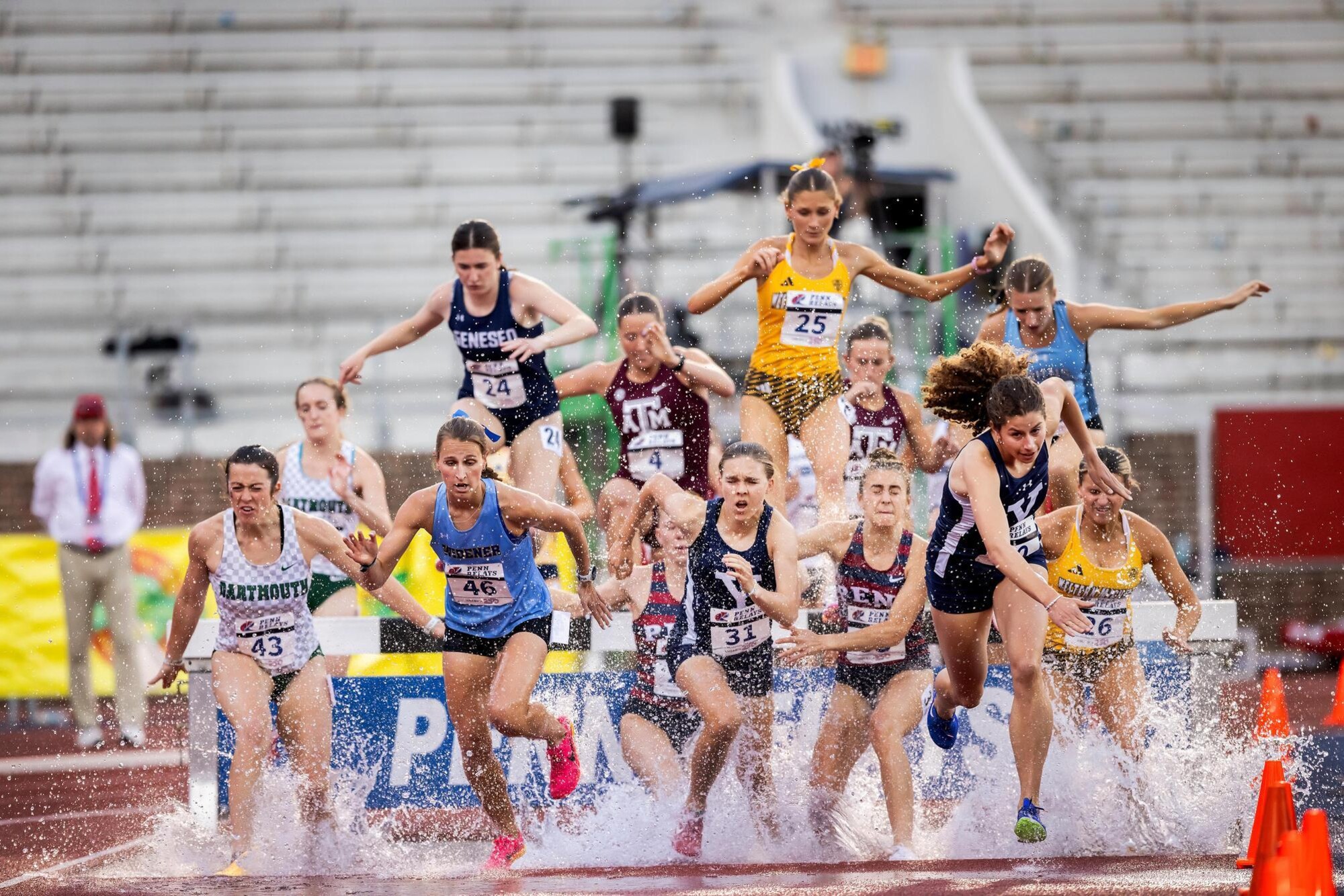 Runners running the steeplechase at Penn Relays.