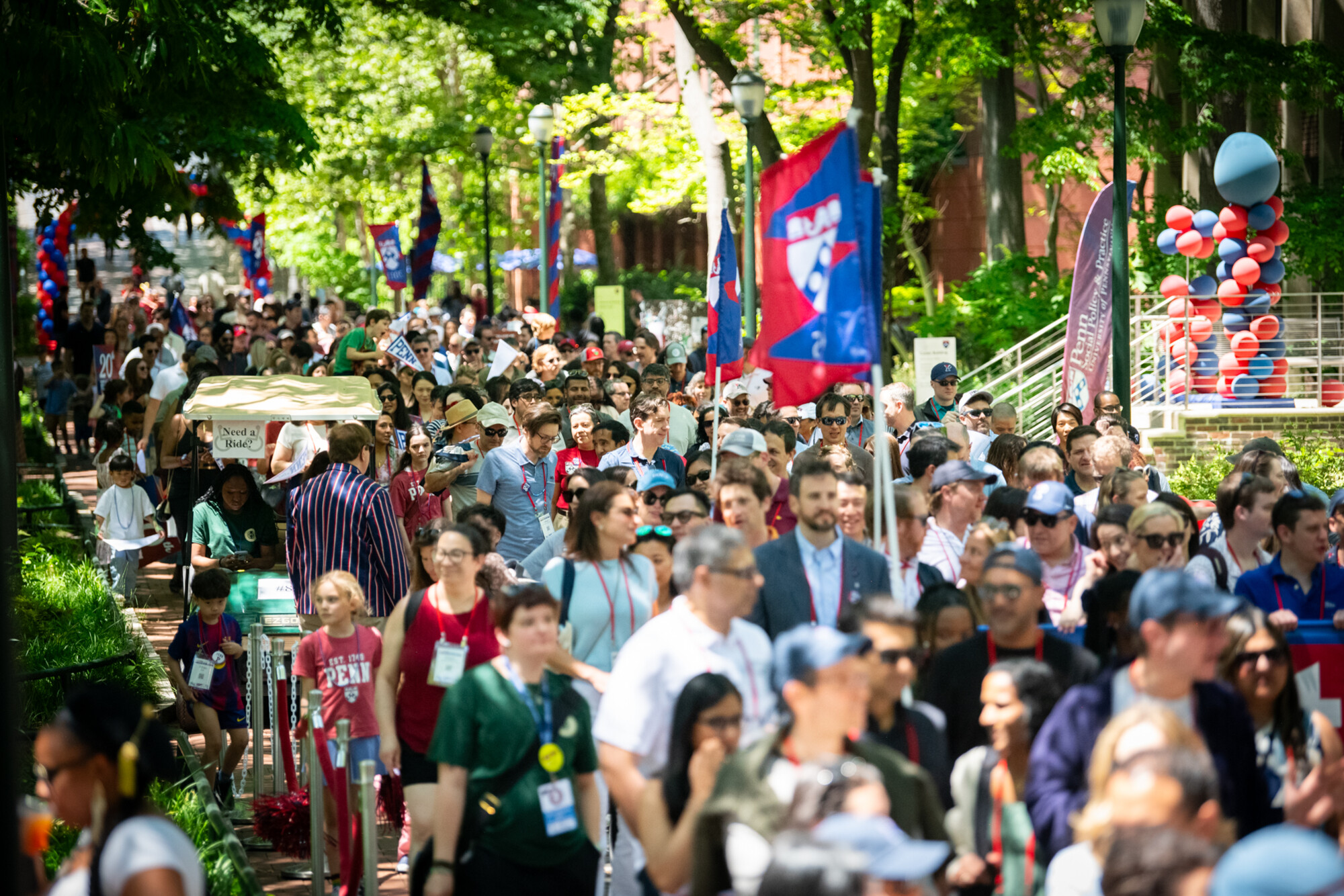 Penn alums in procession down locust walk.