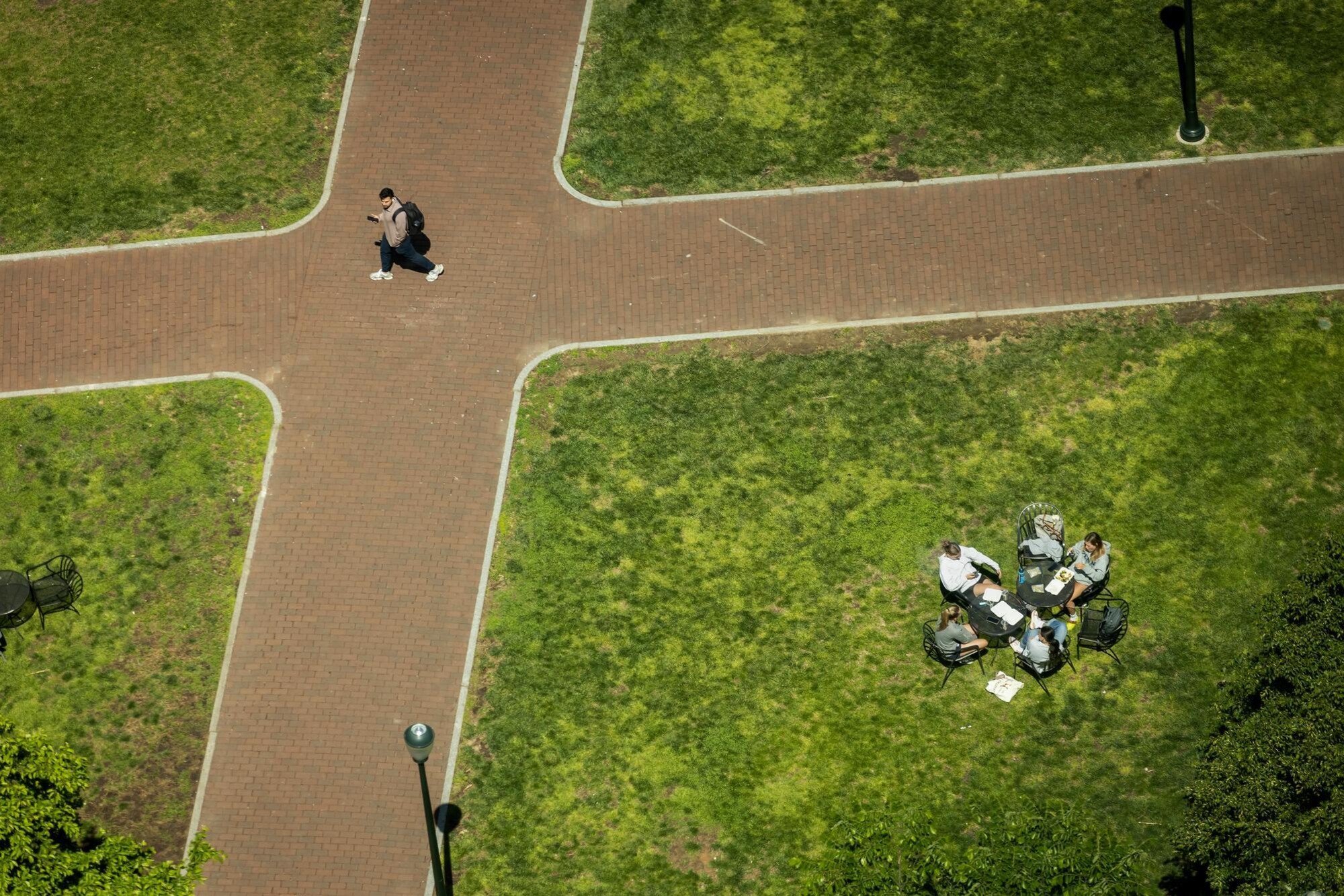 Students sitting outside near Locust Walk during Reading Days.