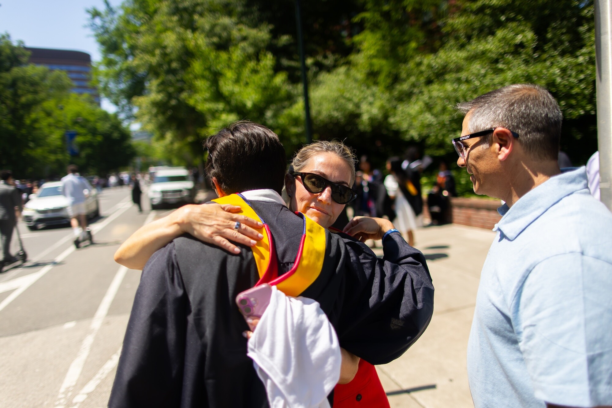 A parent hugging a grad after Penn’s commencement