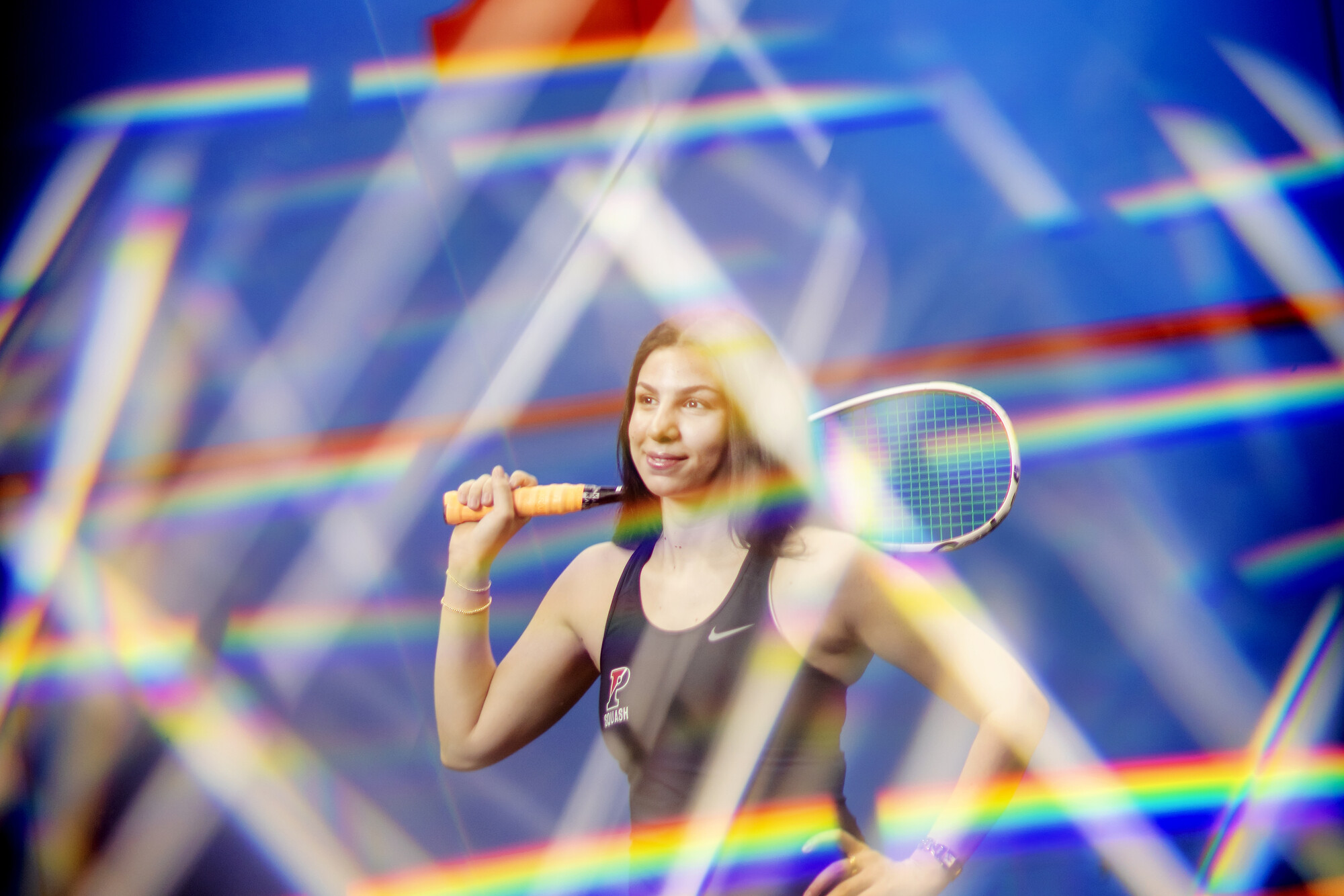 Jana Dweek holding a squash racquet.