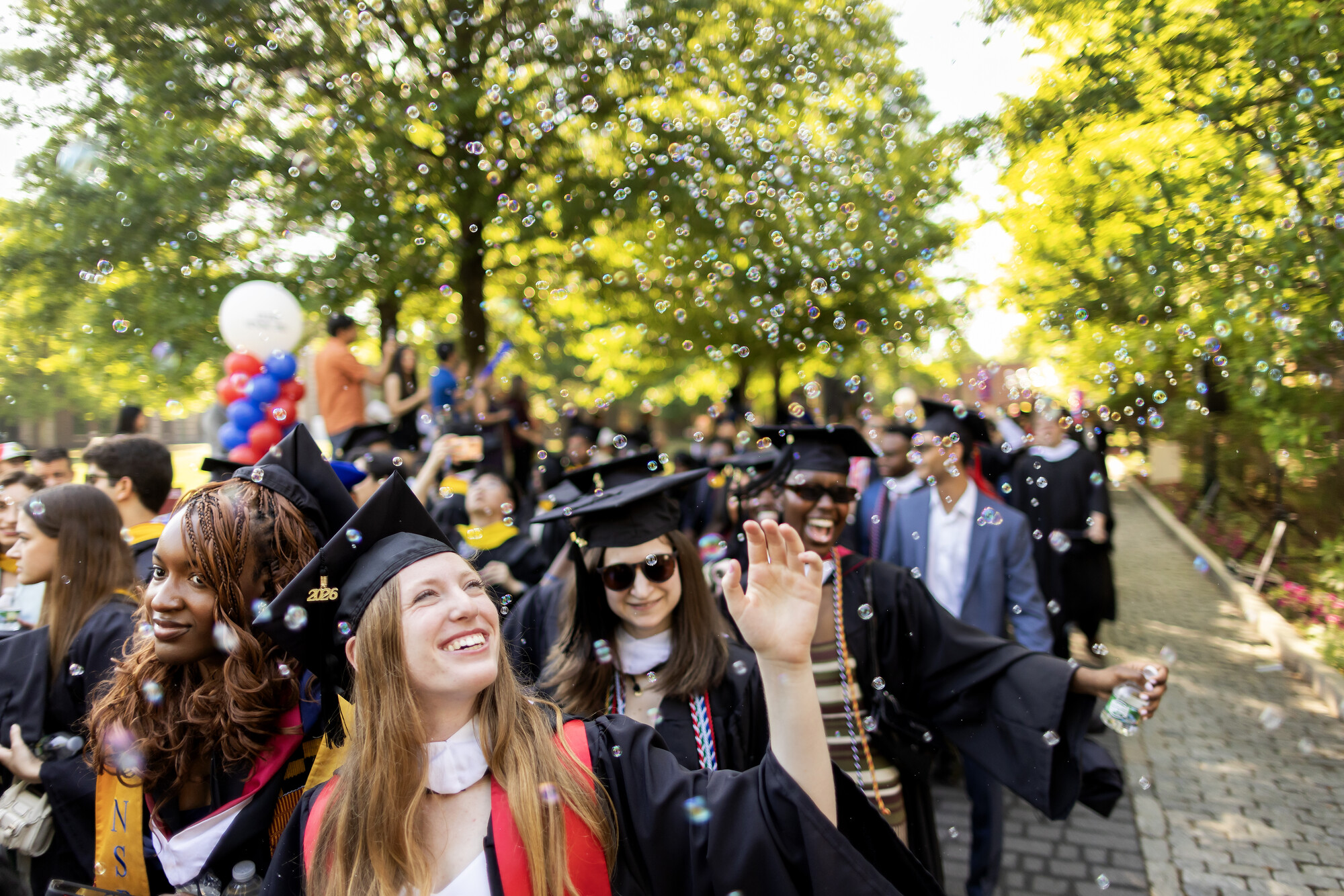 Penn graduates on Locust Walk during commencement.