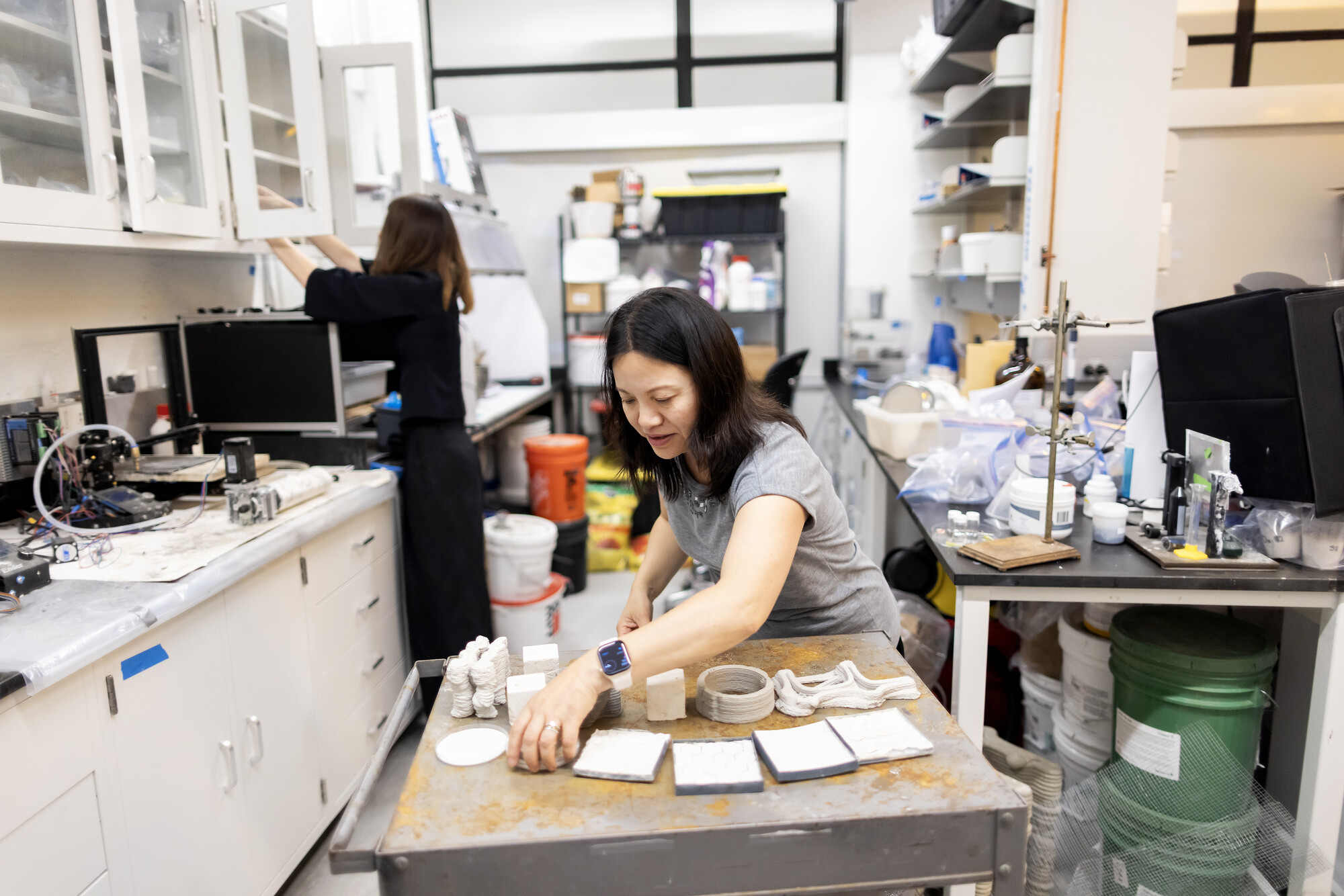 Shu Yang in the lab working with cooling materials.