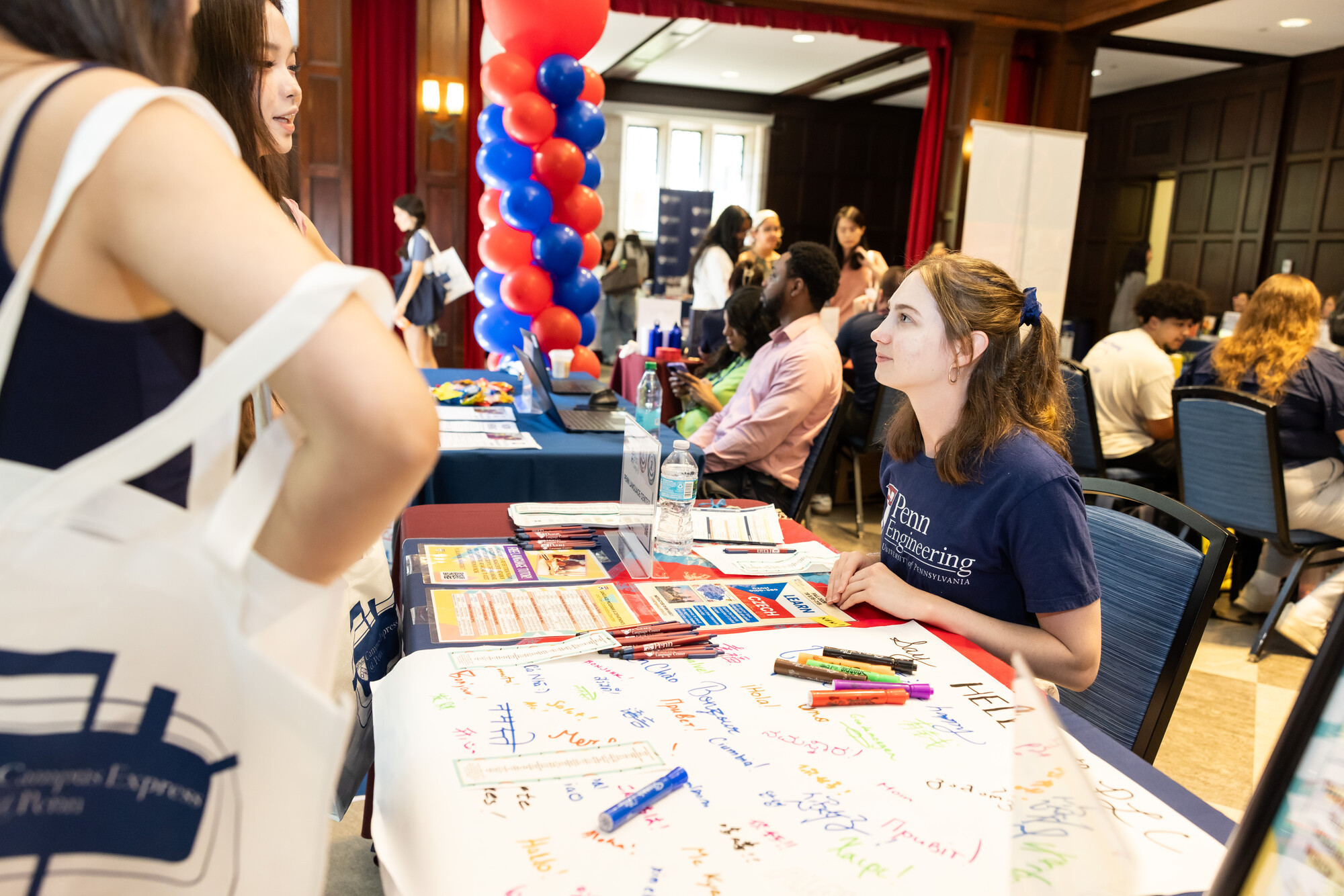 Penn students at a table during a resource fair at Houston Hall.