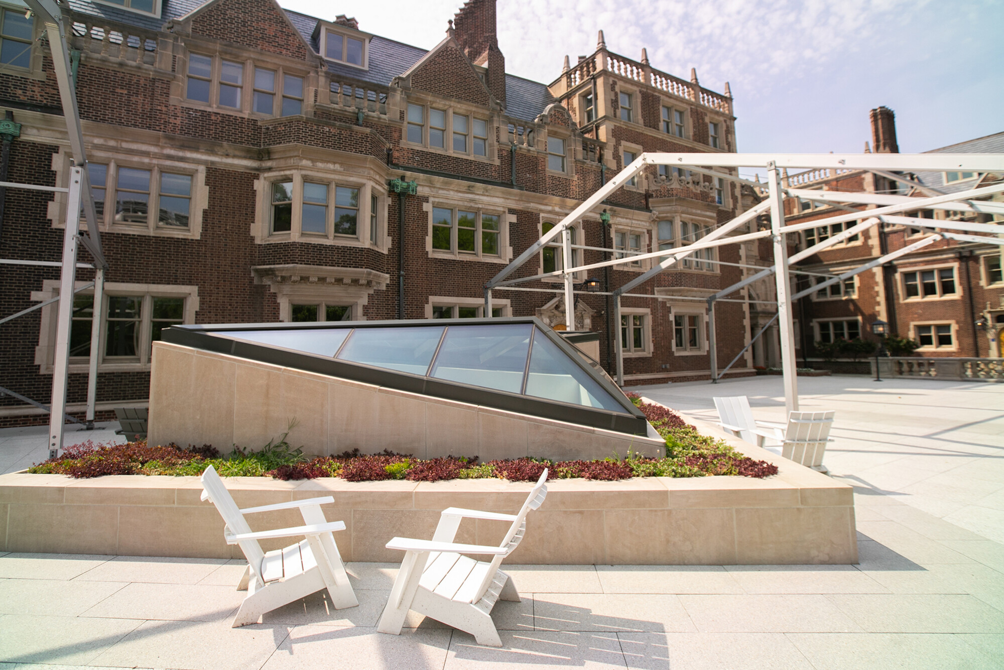 Quad Junior Balcony with a skylight, foliage, and chairs.