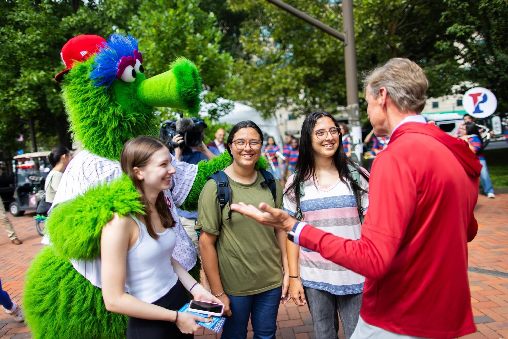 Penn President J. Larry Jameson, three students, and the Philly Phanatic at Move-In.