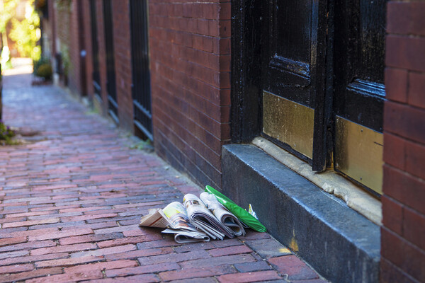 newspapers at door