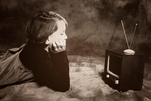 a child watching a small television.