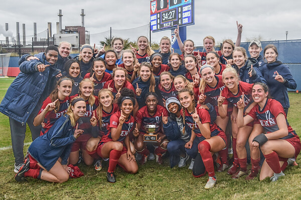 group shot of soccer players holding up number 1 fingers