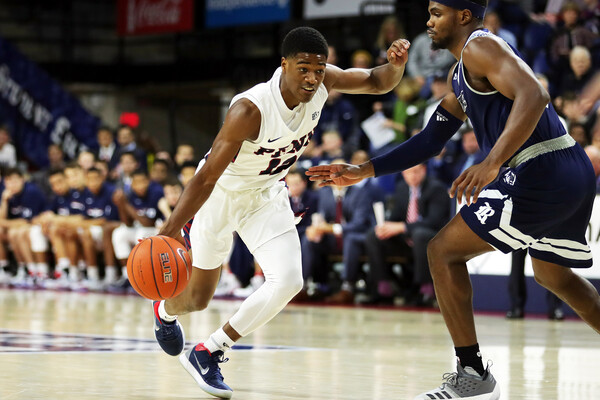 Devon Goodman dribbles down the court