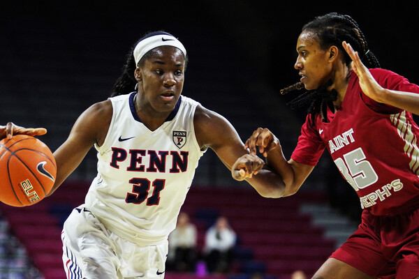 Eleah Parker drives to the basket against Saint Joseph's
