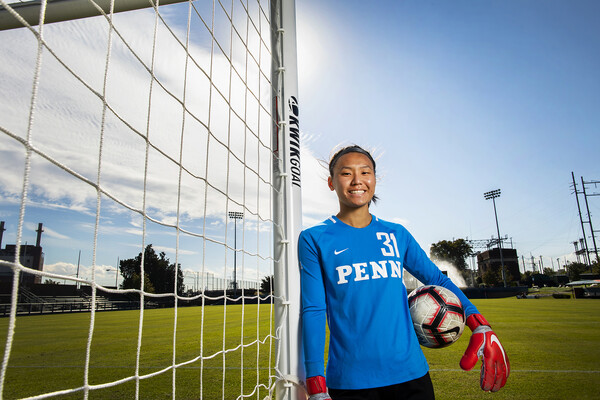 Qu poses at goalpost on Rhodes Field
