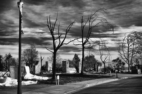 remains of a neighborhood after a wildfire