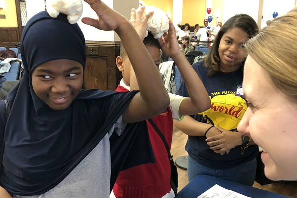 Elementary school students with model brains