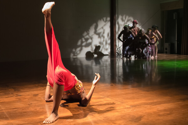 Woman dancing on floor of stage