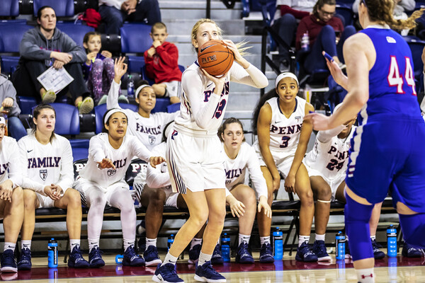 Phoebe Sterba shoots a three against American in the WNIT.
