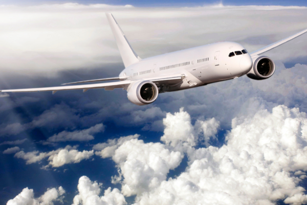 Airplane flying above the clouds