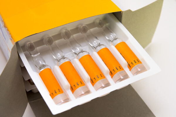 Shipped vials in open cardboard box
