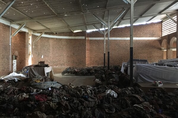 piles of soiled clothing and sheets on church pews and floor