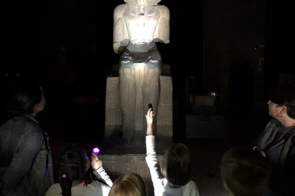 Kids with statue and flashlights
