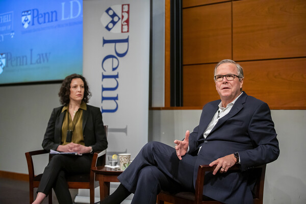 Allison Hoffman and Jeb Bush seated on stage, talking