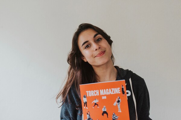 Student holding magazine