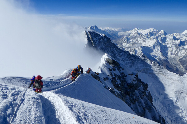 Climbers, including Sophie Hilaire, a 2017 graduate of the Wharton MBA Program, descend from the summit of Mount Everest on May 23.