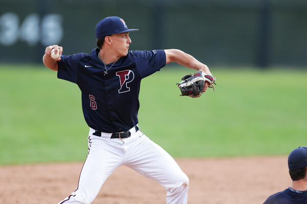 Shortstop Jason Hood of the baseball team prepares to throw the ball to a base.