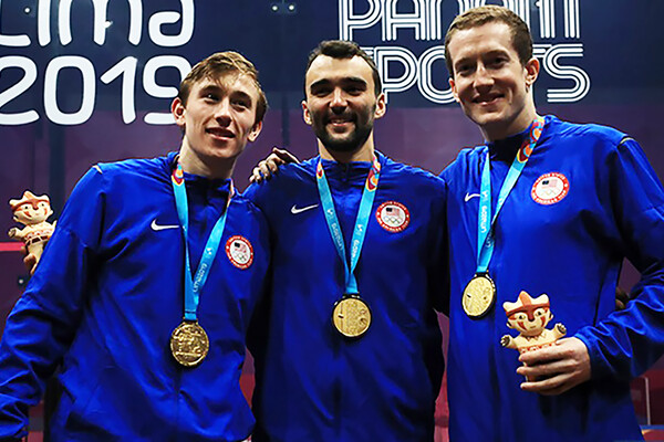 Andrew Douglas, left, poses with the gold medal-winning U.S. men's squash team.