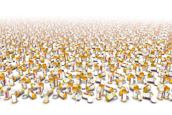 hundreds of empty prescription pill bottles