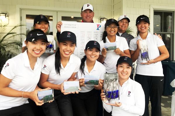 After winning the Lady Blue Hen Invitational, members of the women's golf team pose with their trophies.