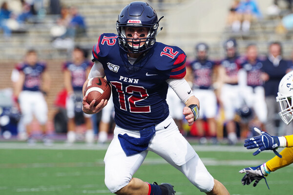 Versus Alderson Broaddus at Franklin Field, Eddie Jenkins makes a move with the ball in his hand.