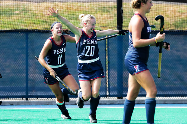 Standing center, Maddy Fagan celebrates with her teammates.