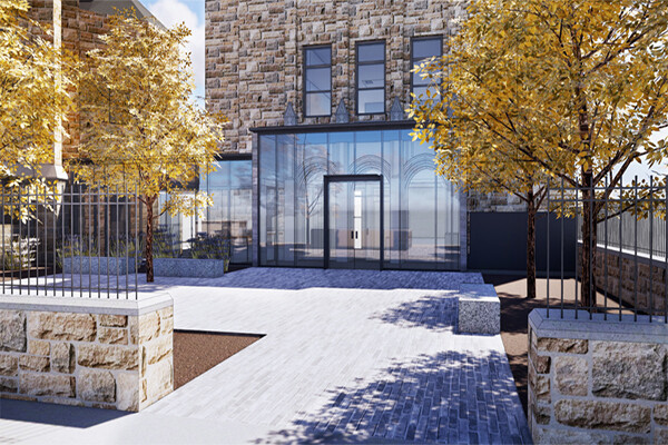 Front facade and stone courtyard of Penn's Newman Center.