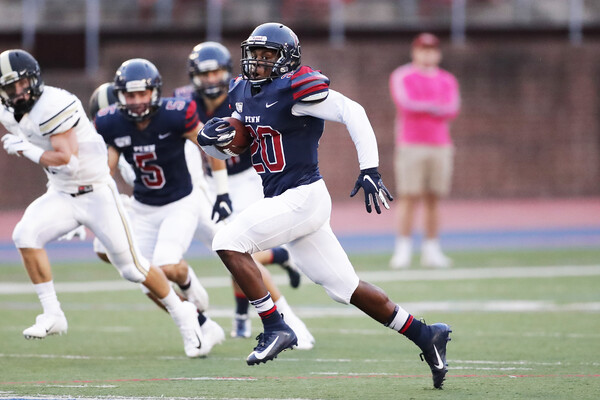 Running back Laquan McKever carries the ball down the field.