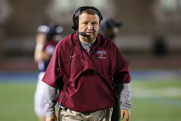 Jerry McConnell, longtime offensive coordinator and now head coach of sprint football, patrols the sidelines during a game.