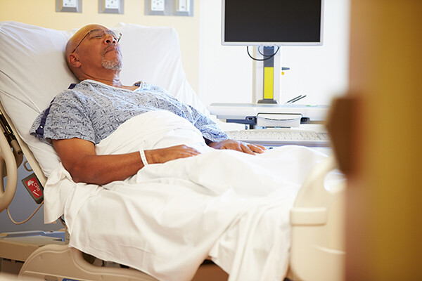 African American patient in a hospital bed