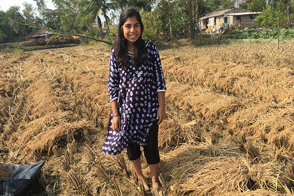 Raka Sen smiles in filed in the Sundarbans region.