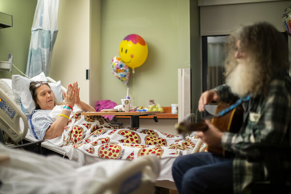 david falcone playing guitar with balloons in the background