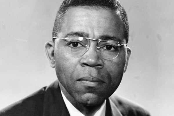 William Fontaine poses for an picture, which is in black and white.