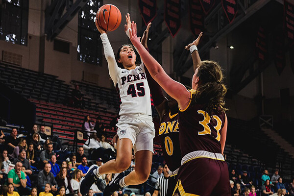 Kayla Padilla shoots a basket during a basketball game