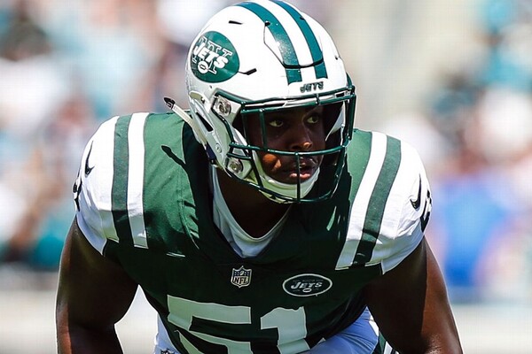 While playing for the New York Jets in New York, Brandon Copeland stands in a two-point stance during gameplay.