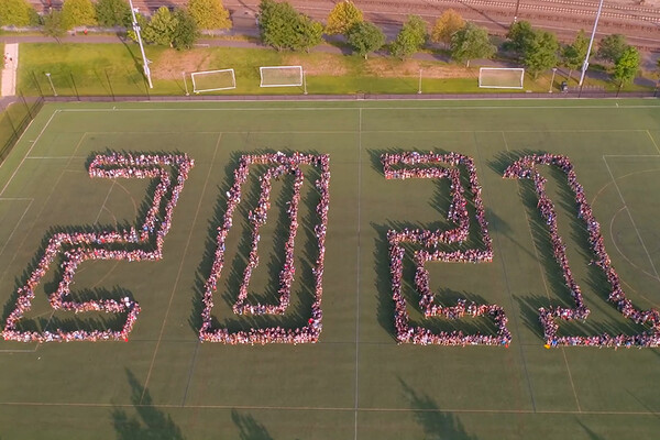 aerial shot of Franklin Field and people standing in formation on the field to spell out 2021