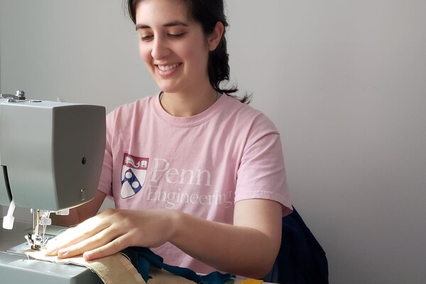 Student Kate Panzer sewing protective mask